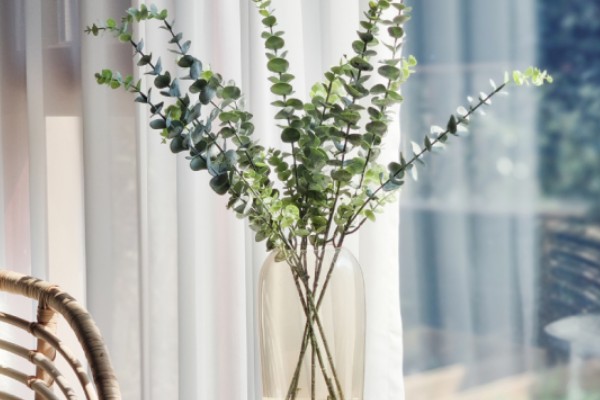 What are the conveniences of artificial plants in terms of maintenance?